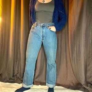 vintage Levi’s 501s medium wash button fly waist measured at 33” length 33”